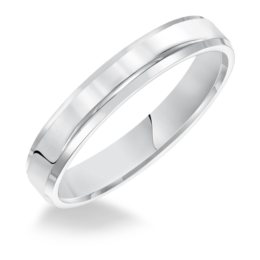 This comfort fit wedding band is crisp and contemporary featuring a high polished beveled edge design.